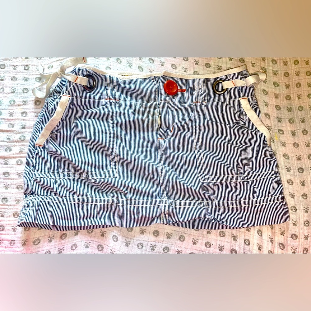 This skirt is summer size 0 striped skirt with all the cute accents EUC